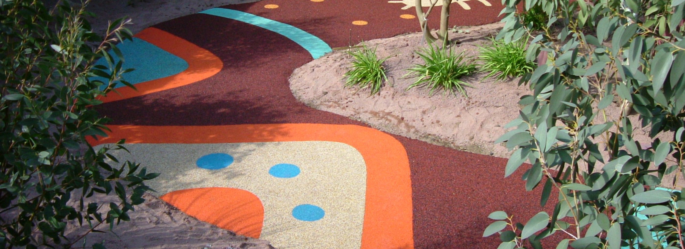 Colourful walkway in a Zoo which has animal footprint designed into it.