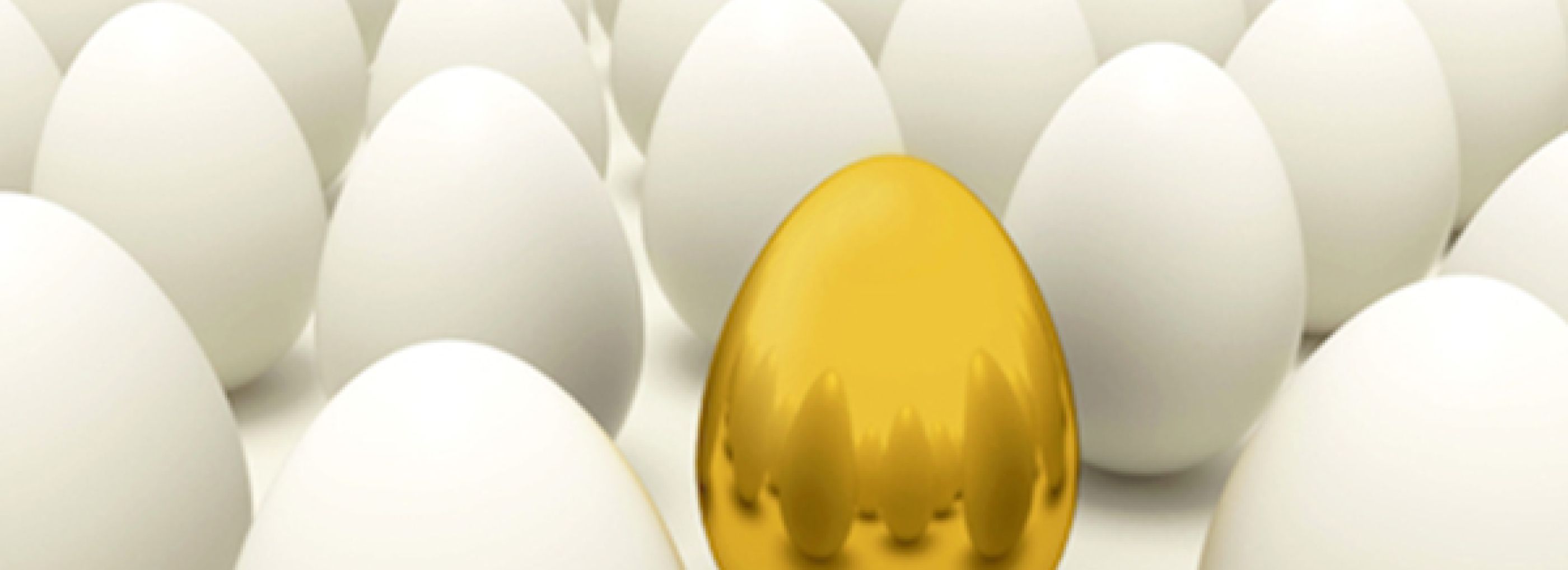 Golden egg sat amongst a number of normal eggs.